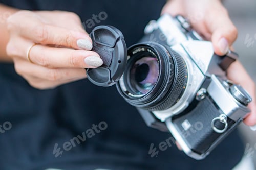 Preview: Removing lens cap from vintage film camera