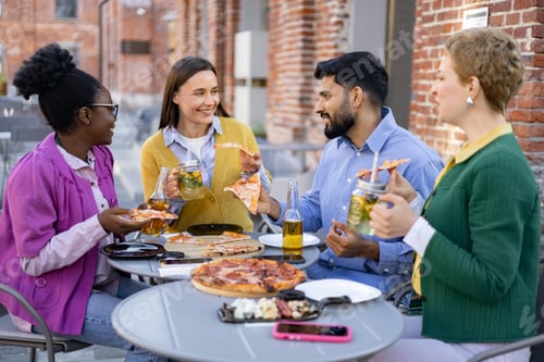 Preview: Friends Enjoying Pizza Outdoors