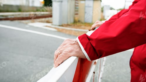 Preview: The Hands Of A Man On The Train Railing