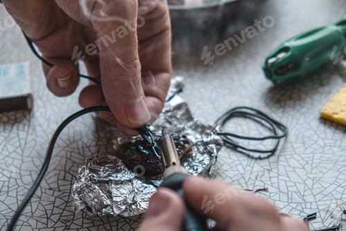 Preview: Repair of the phone charger cable. Tinning of wires with a soldering iron. Rosin smoke.