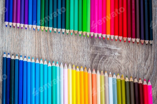 Preview: Multi Color pencils in scale with rainbow style isolated on wooden background