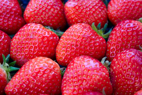 Preview: Close up view of dozen of fresh red strawberries.