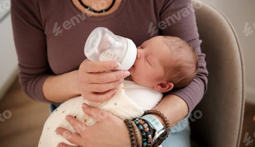 Preview: Feeding a Baby in a Cozy Room During the Day