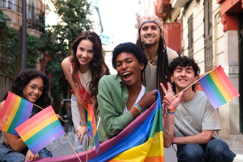 Preview: Young activists showing rainbow flag at LGBT pride parade