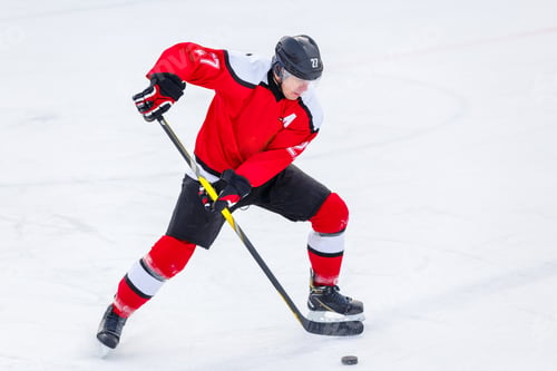 Preview: Professional ice hockey player in attack on the rink