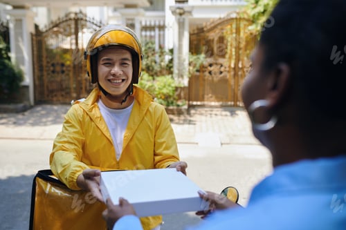 Preview: Delivery Man Giving Woman Pizza Box