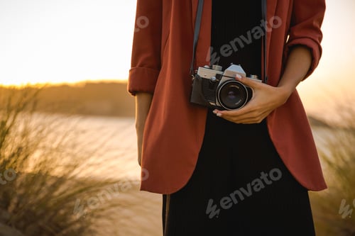 Preview: Woman Taking Picture Outdoors