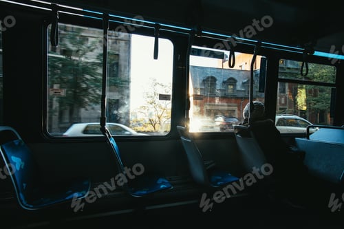 Preview: Beautiful shot of a lonely old man sitting in the empty bus