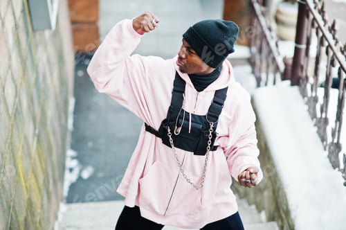 Preview: Stylish urban style african american man in pink hoodie