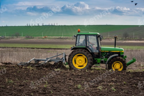 Preview: a tractor 90s with a homemade plow prepares the field for sowing