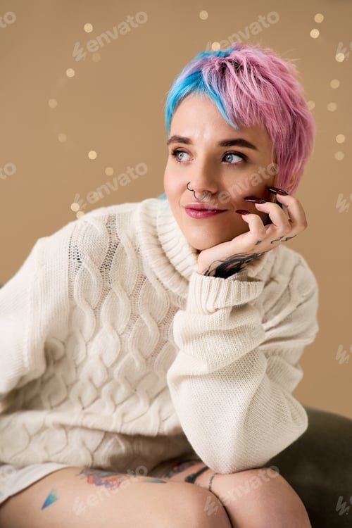 Preview: Beautiful young woman enjoys a festive winter vibe with colorful hair and cozy fashion
