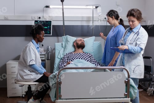 Preview: Medical team monitoring sick man explaining disease symptom