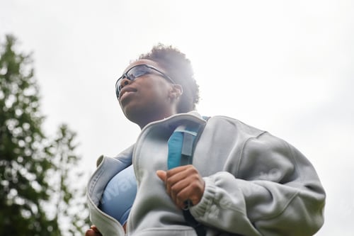 Preview: Black Woman with Backpack Outdoors