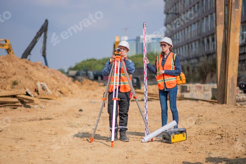 Preview: Construction surveyor or engineer working construction site leveling rod and theodolite mounted trip