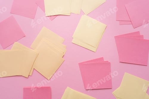 Preview: top view of empty paper notes on pink