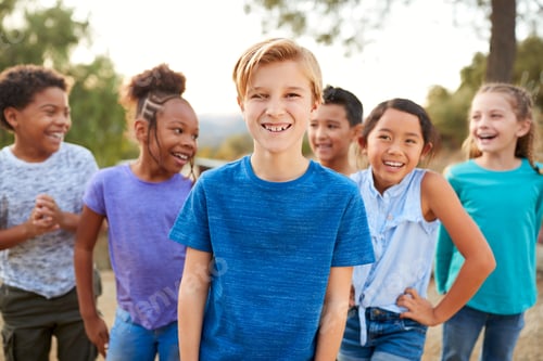 Preview: Portrait Of Multi-Cultural Children Hanging Out With Friends In Countryside Together