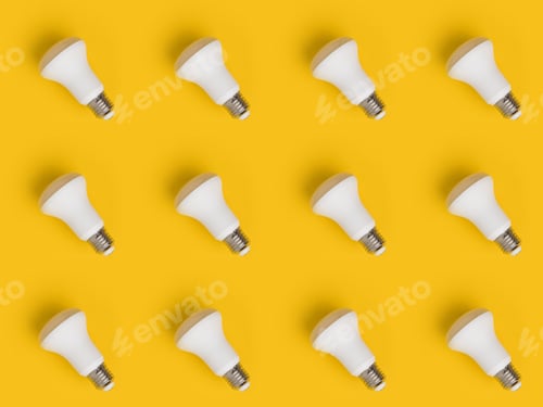 Preview: full frame of arrangement of light bulbs isolated on yellow
