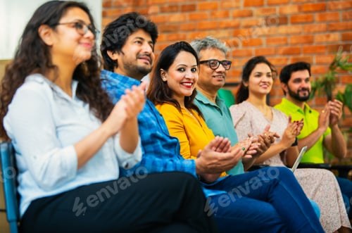 Preview: Indian Young business professionals gathering for corporate training session in professional office
