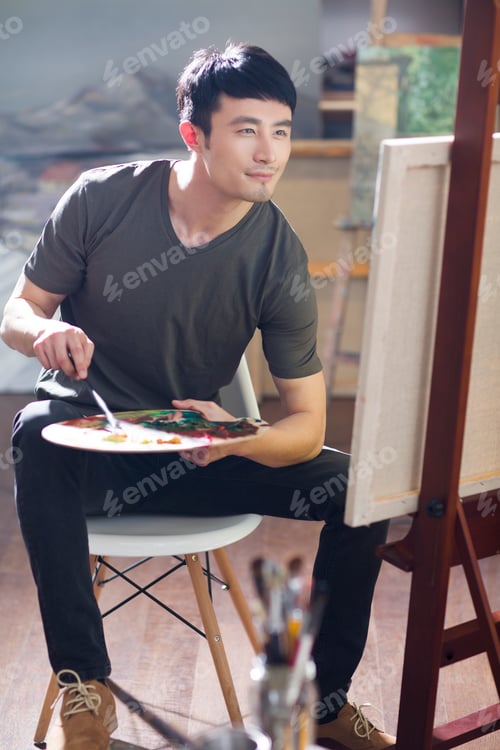 Preview: Artist painting in his studio