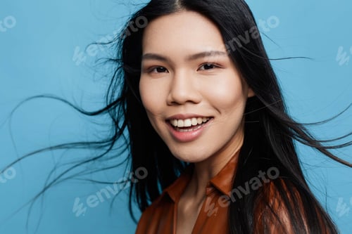Preview: Happy woman smile blue studio asian background