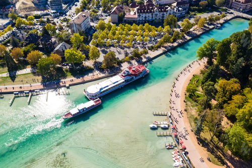 Preview: Aerial view of Annecy lake waterfront low tide level due to the