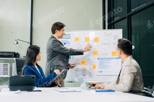Preview: Office colleagues have a casual discussion. During a meeting in a conference room