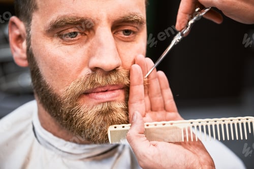 Preview: Man Gets Beard Trimmed at Barbershop Close Up