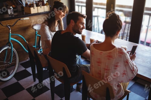 Preview: Friends having coffee at restaurant