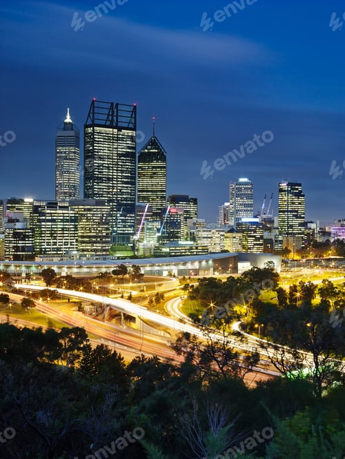 Preview: City skyline at twilight with dynamic car light trails