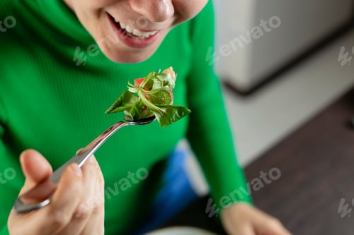 Preview: Eating a vegetable salad. Healthy food and diet concept.