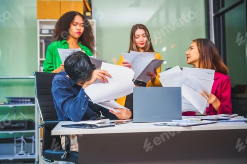 Preview: Asian colleagues, middle-aged man and young woman, happily collaborate in office workplace