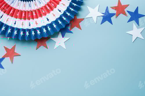 Preview: 4th of July background. USA paper fans, Red, blue, white stars and confetti on blue wall background.