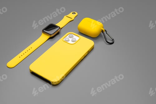 Preview: Yellow smartphone, smartwatch and earphones on gray background