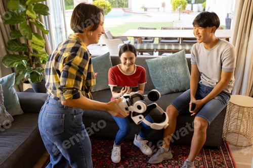 Preview: Playing with VR headset, family enjoying time together in living room
