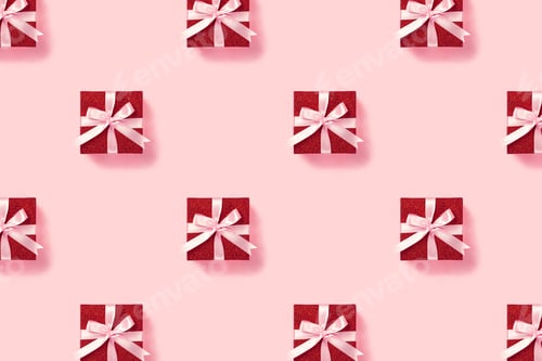 Preview: Red gift box with pink ribbon on pink background.