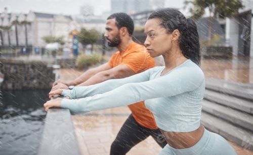 Preview: Workout, stretching and couple of friends training with focus before running in the rain. Urban, ru