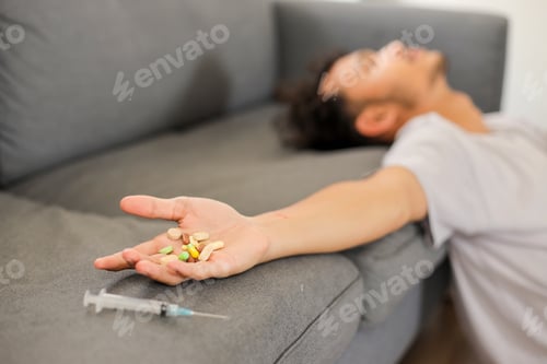 Preview: Hands Attempting Suicide With Pills And Syringe At Home