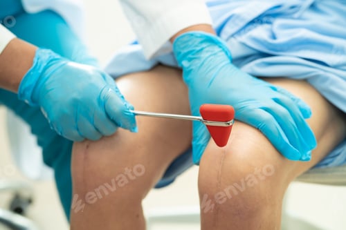 Preview: Asian doctor use hammer knock senior woman patient to check knee reflex, nerve and muscle