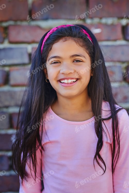 Preview: Cute and colourful. Portrait of an adorable young girl outside.