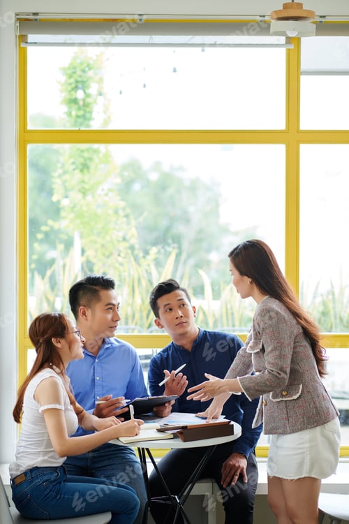 Preview: Business team at cafe table