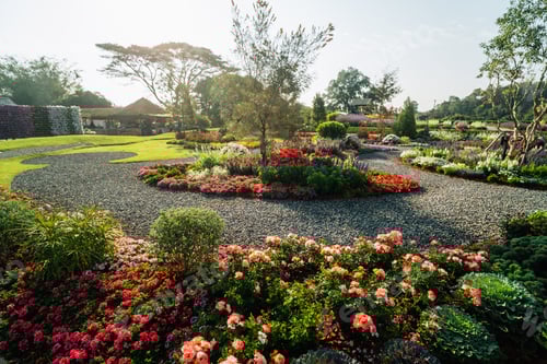 Preview: Beautiful organic vegetable garden with raised brick beds, tomato arch trellis