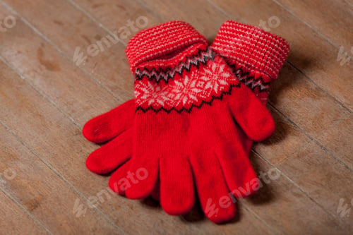 Preview: photo of cool warm gloves on the wonderful brown wooden background