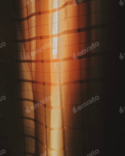 Preview: Orange Light Filtering Through Sheer Curtains At Sunrise
