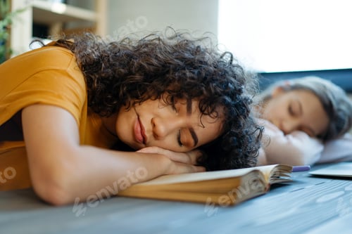 Preview: Tired diverse teenage girls and friends fell asleep as they prepared for the exam.