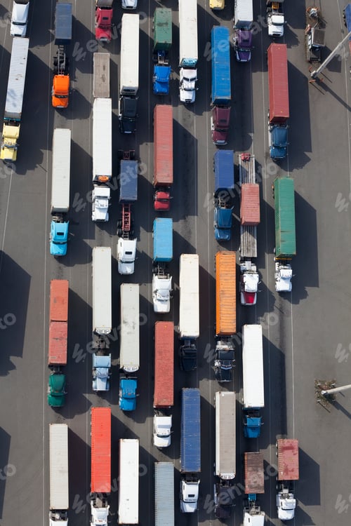 Preview: Aerial View of Semi Trucks at a Port