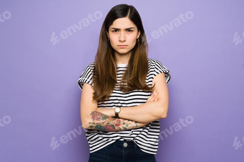 Preview: Portrait of an attractive woman looking annoyed
