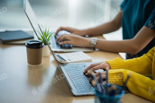 Preview: Close-up of a female accountant pressing a laptop keyboard. working over the internet Financial prof