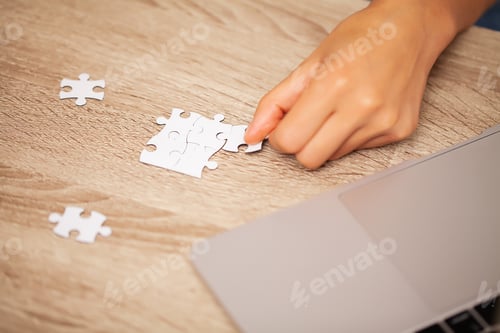 Preview: Business success concept, woman makes up puzzle