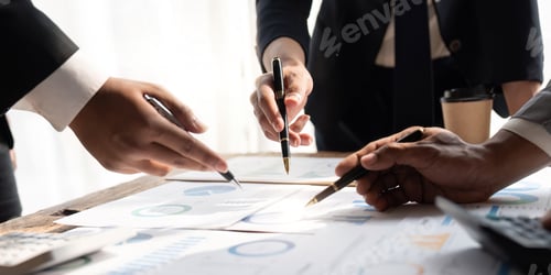 Preview: Business team analyzing income charts and graphs with modern laptop computer. Close up.Business