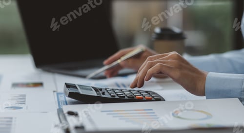 Preview: Businessman working at office with documents on his desk, doing planning analyzing the financial rep